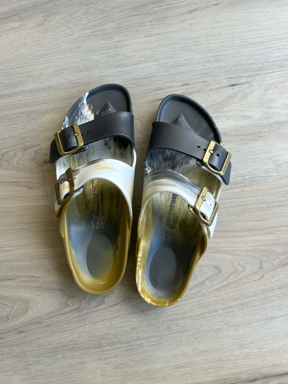 Birkenstock Two-Tone Buckle Slide Sandals in Black, White & Gold
